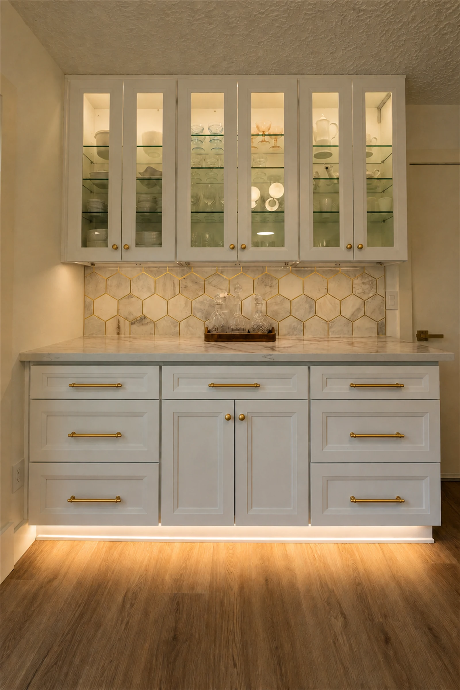Custom bar cabinetry with marble backsplash and unlacquered brass hardware, Portland OR kitchen remodeling